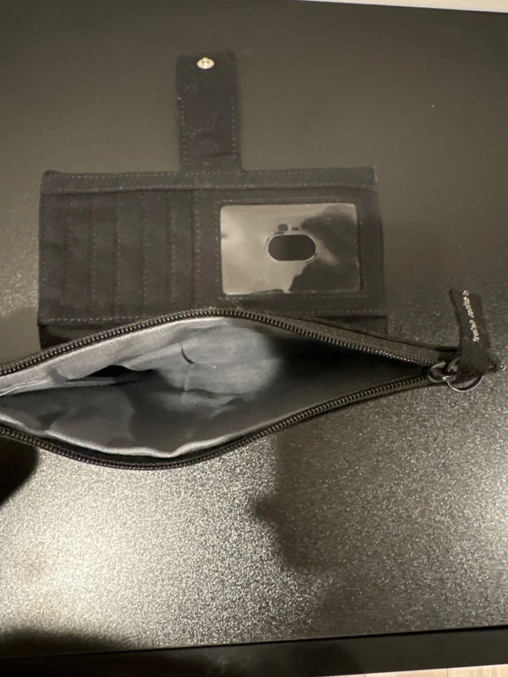 Black, white and grey soft sided wallet